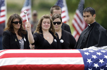 Matthew Kuczora, C.S.C. at the blessing of his friend Brandon&rsquo;s casket.